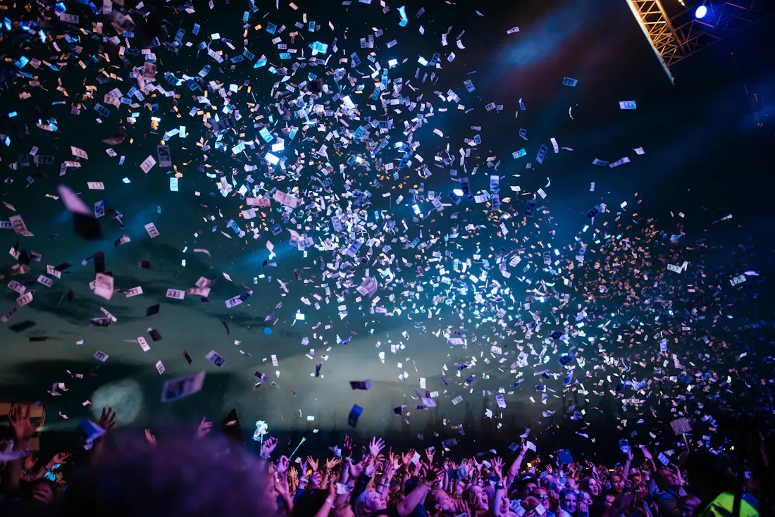 Festive lights strung above a night celebration