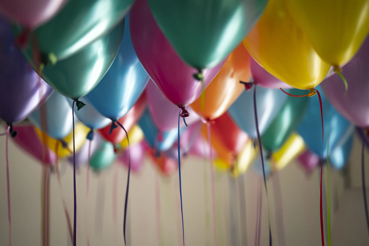 Guests applauding at a surprise birthday reveal